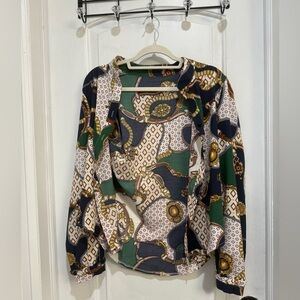 Women’s long sleeve medium blouse. Great for going out and or work!